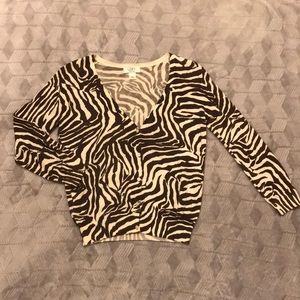 Zebra print cardigan with five front buttons.